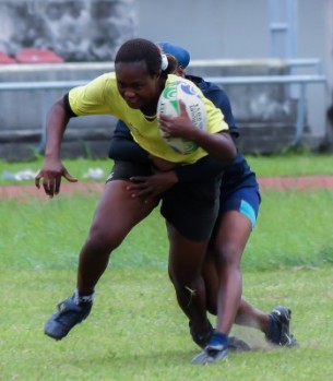 Funmilayo Aladeyelu is being tackled by an opponent during the women select match on saturday