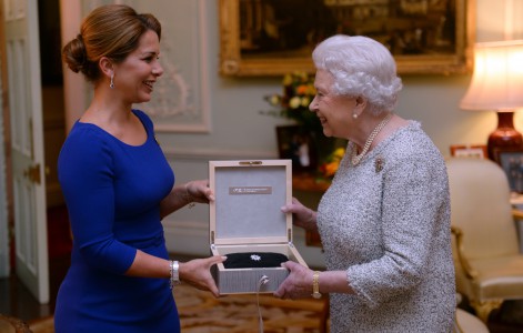 Queen Elizabeth II is presented with the Federation Equestre Internationale (FEI) lifetime achievement award for her devotion to equestrian sport by Princess Haya of Jordan (left), at Buckingham Palace, London. PRESS ASSOCIATION Photo. Picture date: Wednesday November 26, 2014. Photo credit: Anthony Devlin/PA Wire