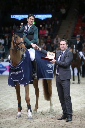 Olympic champion, Switzerland's Steve Guerdat, pictured with Casper Gebeke, Longines Sweden country manager, after winning the twelfth and final qualifying round of the Longines FEI World Cup™ Jumping 2014/2015 Western European League with the mare Albfuehren's Paille at Gothenburg, Sweden today. (FEI/Roland Thunholm)
