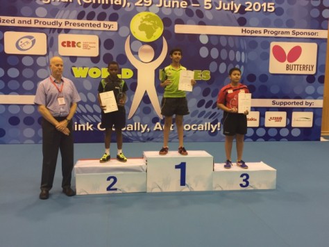 Nigeria's Abayomi Animasahun (second left) during the medal presentation at the 2015 ITTF Hopes Challenge in Shanghai, China at the weekend.