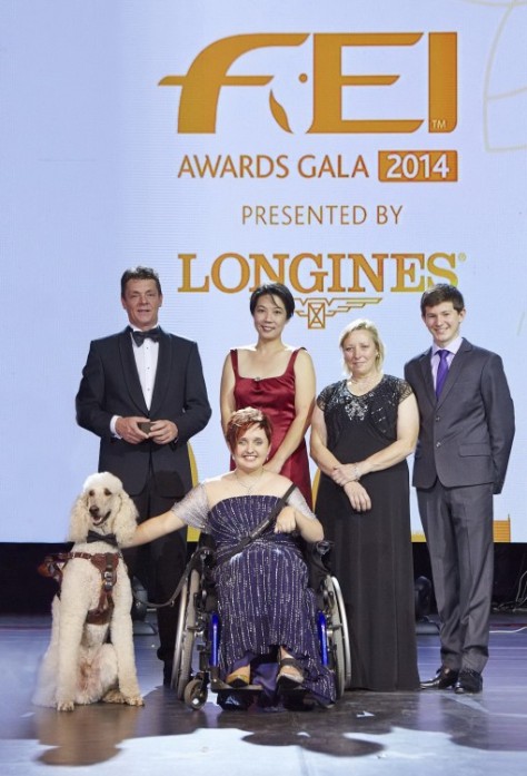 Equestrian heroes celebrated at the FEI Awards 2014, in association with Longines and with international fashion designer Reem Acra (left to right): Jeroen Dubbeldam (NED), Melissa Tan (SIN) chairman of equine therapy centre Equal Ark, Jackie Potts (GBR), Lambert Leclezio (MRI) with (centre) Sydney Collier (USA) and her service dog Journey. (FEI/Liz Gregg)
