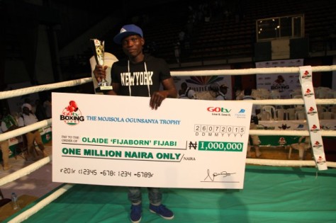 Olaide Fijabi, winner of a trophy and One Million Naira during 3rd GOtv Boxing Night held at the Indoor Sports Hall of National Stadium Surulere, Lagos.