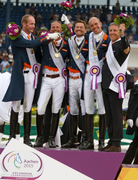 The Netherlands claimed the FEI European Dressage Championships 2015 team title at Aachen, Germany today. On the podium: Diederik van Silfhout, Patrick van der Meer, Edward Gal, Hans Peter Minderhoud and Chef d’Equipe Wim Ernes. (FEI/Dirk Caremans)