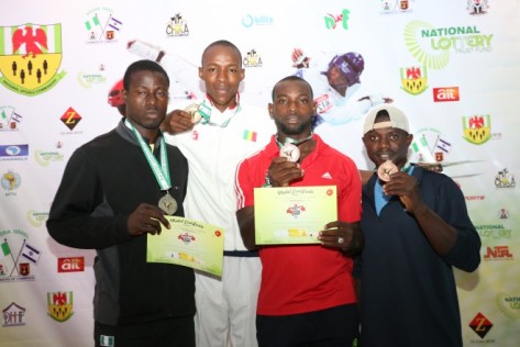 Mali’s Golden Star, Karamoko Soumare, stands heads above Silver Medallist, Temitope Oyo [Nigeria National Team] and Bronze Medallists, Sunday Onofe [Nigeria National Team] and [MALI] during the medal ceremony for the +80kg category at the just concluded 3rd CCSF Opens