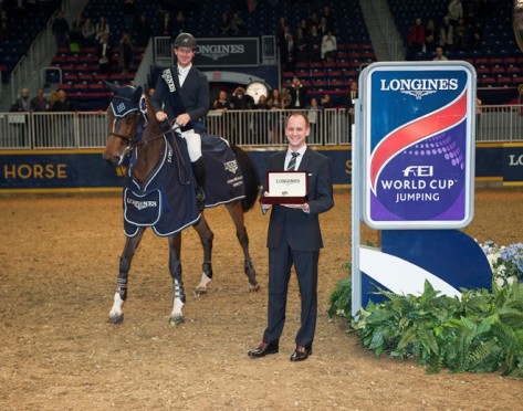 McLain Ward (USA) and HH Azur, winners of the $132,000 Longines FEI World Cup™ Jumping qualifier in Toronto (CAN), were presented with a Longines watch by Ian Charbonneau, Longines brand manager, Canada. (FEI/Peter Llewellyn)