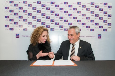 Reem Acra (left), the internationally renowned fashion designer, has extended her partnership with the FEI World Cup™ Dressage Western European league and series Final for a further three-year term through to 2019. She is pictured here with FEI President Ingmar De Vos at the official signing ceremony, which took place backstage at the Reem Acra Fall 2016 ready-to-wear runway show during last month’s New York Fashion Week. (FEI/Peter Roessler) 